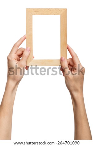 One framework in hands isolated on white background. Female hands holding a blackboard chalkboard. Hand show the wooden frame.Alpha.