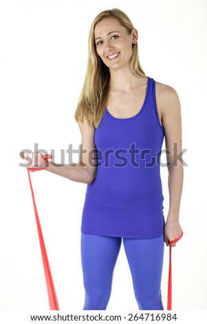 Fit woman stretching rubber stretch band - isolated over white background