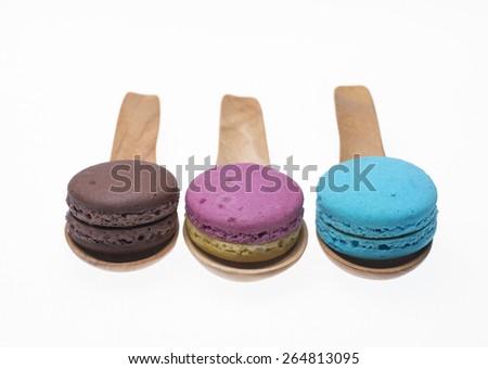 Colorful macarons on white background. Macaron is sweet meringue-based confection.