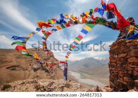 tibetan flags with mantra on sky background Royalty-Free Stock Photo #264817313