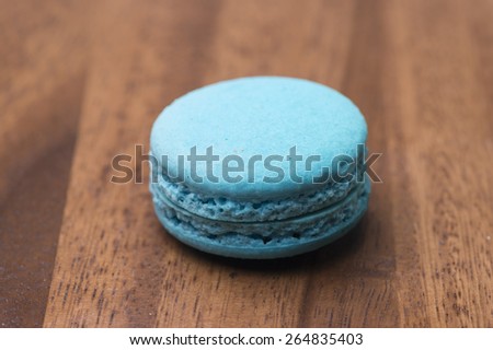 blue macaroons on wooden background