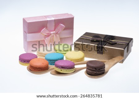 Gift sets of Colorful macarons on white background
