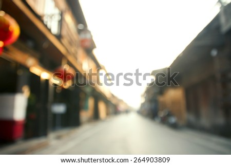 Bokeh background, street, road, sun , Street in chiang khan city in bokeh. Defocused background.