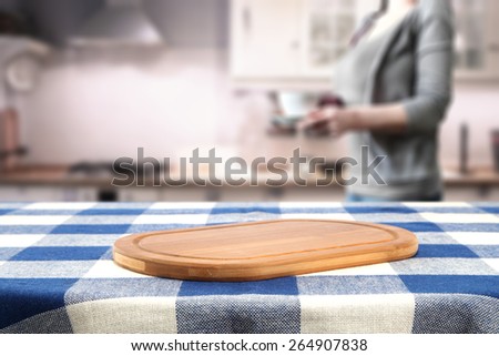 wooden desk space and woman with coffee in hand 