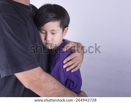 The boys have been embraced in order to relieve the sadness. Royalty-Free Stock Photo #264942728