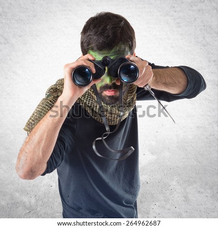 Soldier with binoculars over white background  