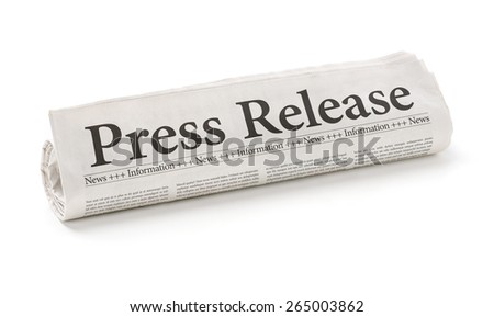Rolled newspaper with the headline Press Release Royalty-Free Stock Photo #265003862