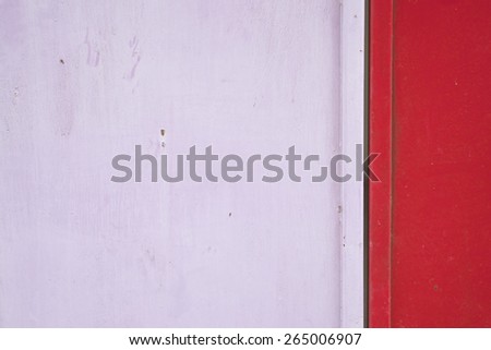 Old and rust pink and red metal door as background with copy space.