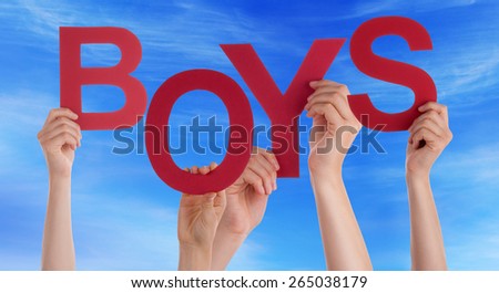 Many Caucasian People And Hands Holding Red Letters Or Characters Building The English Word Boys On Blue Sky