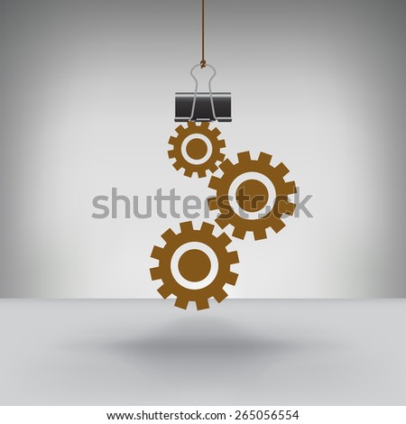 A Set of Gears Hung by a Binder Clip
