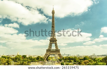 Paris postcard, beautiful scenery of Eiffel Tower and Paris city, France. View of international landmark on sky background, nice Paris skyline in summer, vintage style photo. Travel in France theme.