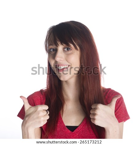 Close up Happy Young Woman in Red Shirt Showing Two Thumbs up Sign While Looking at the Camera. Isolated on White Background.