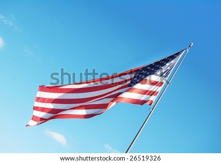American flag with blue sky as the background