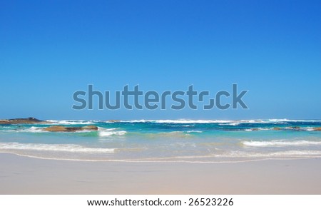 a pristine beach on a bright summer day
