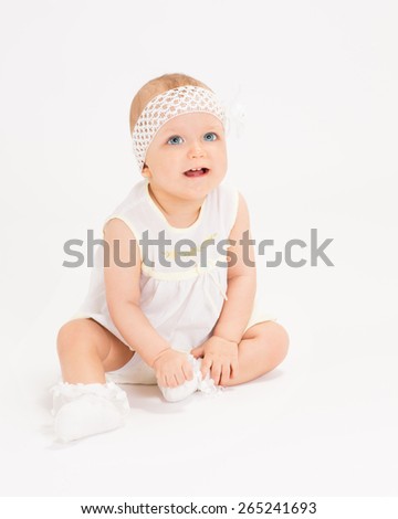 infant age ten months on a white background