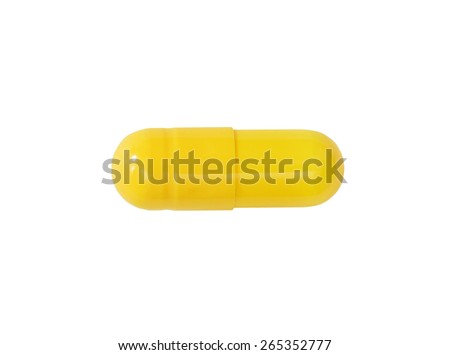 Macro yellow medical pill tablet isolated on white
