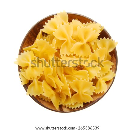 Dry noodle in wooden bowl on white background 