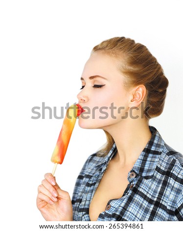 Portrait of beautiful young woman enjoying sweet ice cream or lollipop on white background, blank copy space for advertising text Royalty-Free Stock Photo #265394861