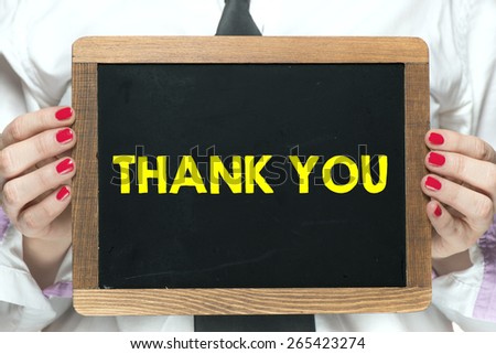 Blackboard with handwritten thank you. Hands holding blackboard with handwritten thank you