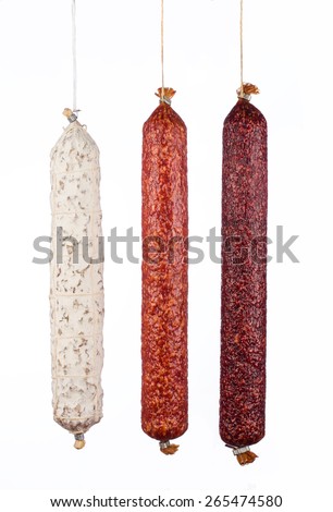  salami sausages isolated on white background Royalty-Free Stock Photo #265474580