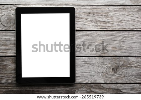 digital tablet on the table with isolated screen for your image and a copy space