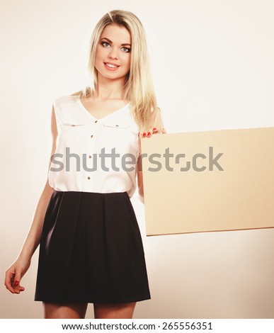 Advertisement concept. Fashion woman with blank presentation board. Female model holds banner sign billboard copy space for text. Isolated