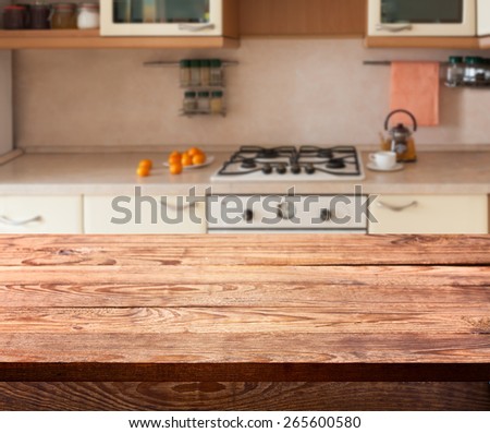 Kitchen. Empty wooden deck table with tablecloth for product montage. Free space for your text