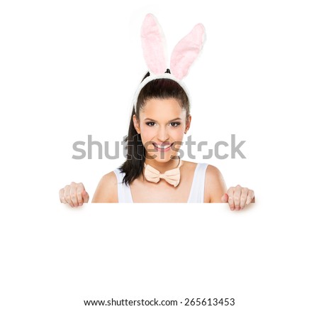 Cute woman with bunny ears holding a white blank sign