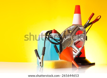 different car accessories on yellow background