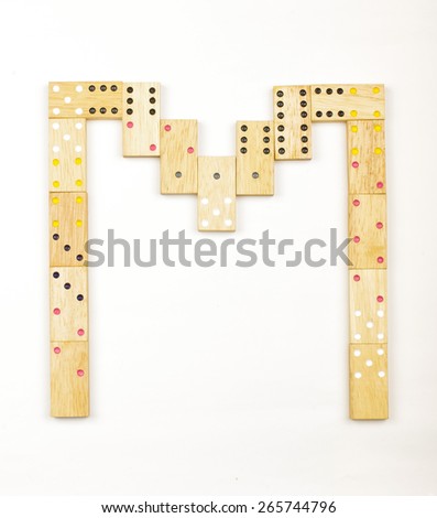 Alphabet letter M arranged from wood dominoes tiles isolated