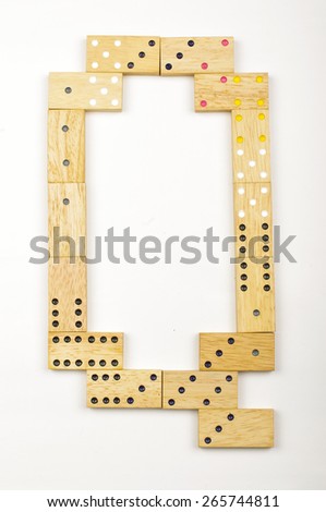 Alphabet letter Q arranged from wood dominoes tiles isolated