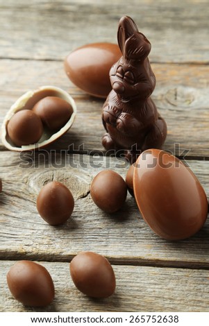 Chocolate easter eggs on grey wooden background