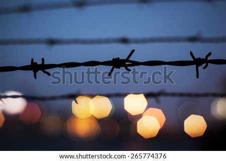 Barbed wire with bokeh background.