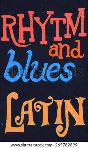 Rhythm and blues, latin, painted on a stucco wall. Part of a series. 