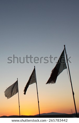 3 flags at sunset