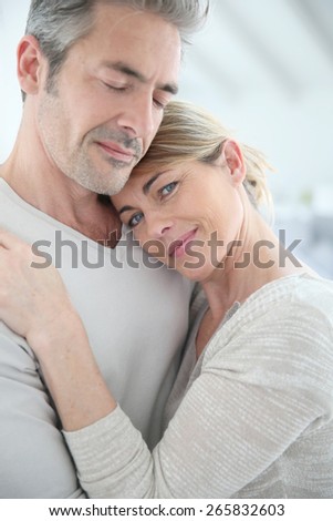 Mature couple embracing with love and tenderness