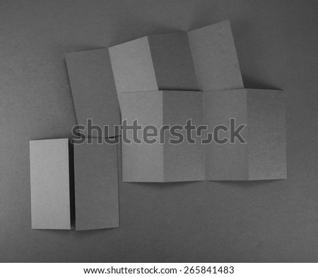 Blank paper brochure on gray background