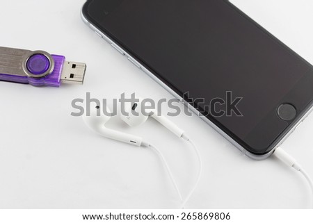 White Earphone and Smartphone equipment set isolated on white background : iPhone