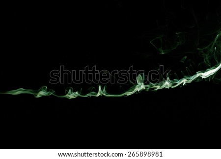 Green smoke trail isolated on black