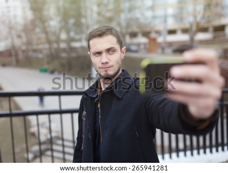 beautiful stylish brutal hipster guy selfie