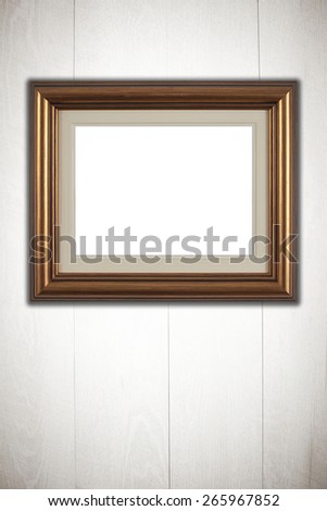 Photo or painting frame on wooden background.