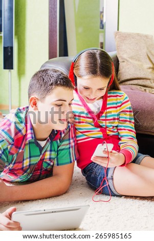 children using electronic tablet and mobile phone