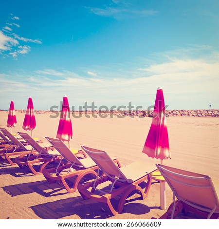 Beach Umbrella and Sun Bed in the Low Season of the French Riviera, Vintage Style Toned Picture