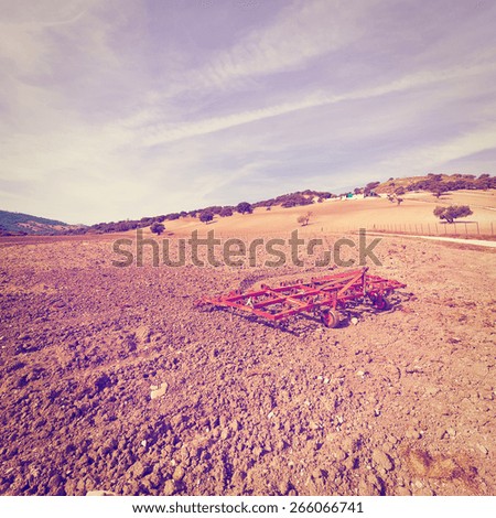 Landscape with Harrow on the Plowed Field in Spain, Vintage Style Toned Picture