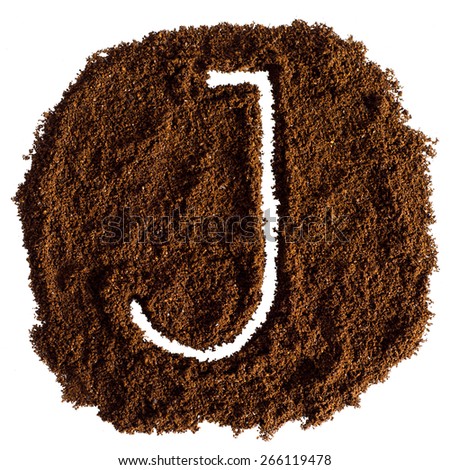 The letter J written on-ground coffee