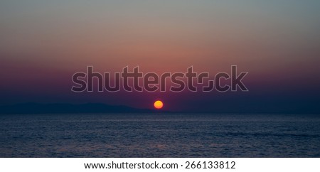 The sunset and the island of the Mediterranean