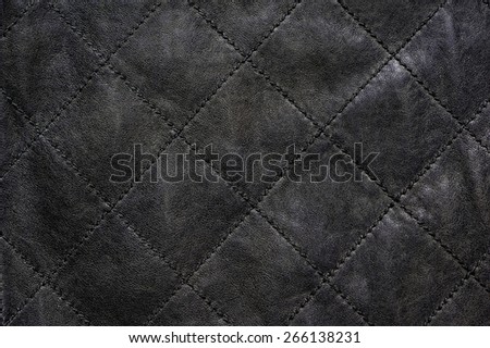 Gray natural leather stitched diagonally
