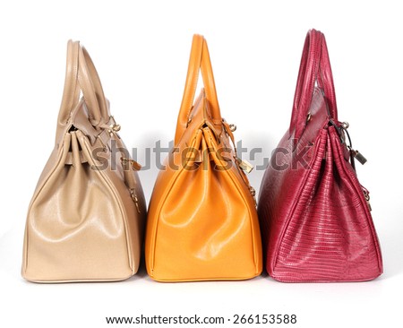 Beige yellow purple genuine leather bags isolated on white background