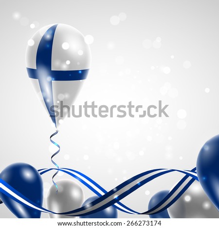 Finnish flag on balloon. Celebration and gifts. Ribbon in the colors are twisted. Independence Day. Balloons on the feast of the national 