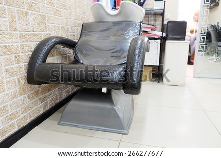 Bowl for head washing and armchair in Beauty Salon.